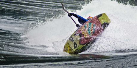 Emptying a Whitewater Kayak while on the River